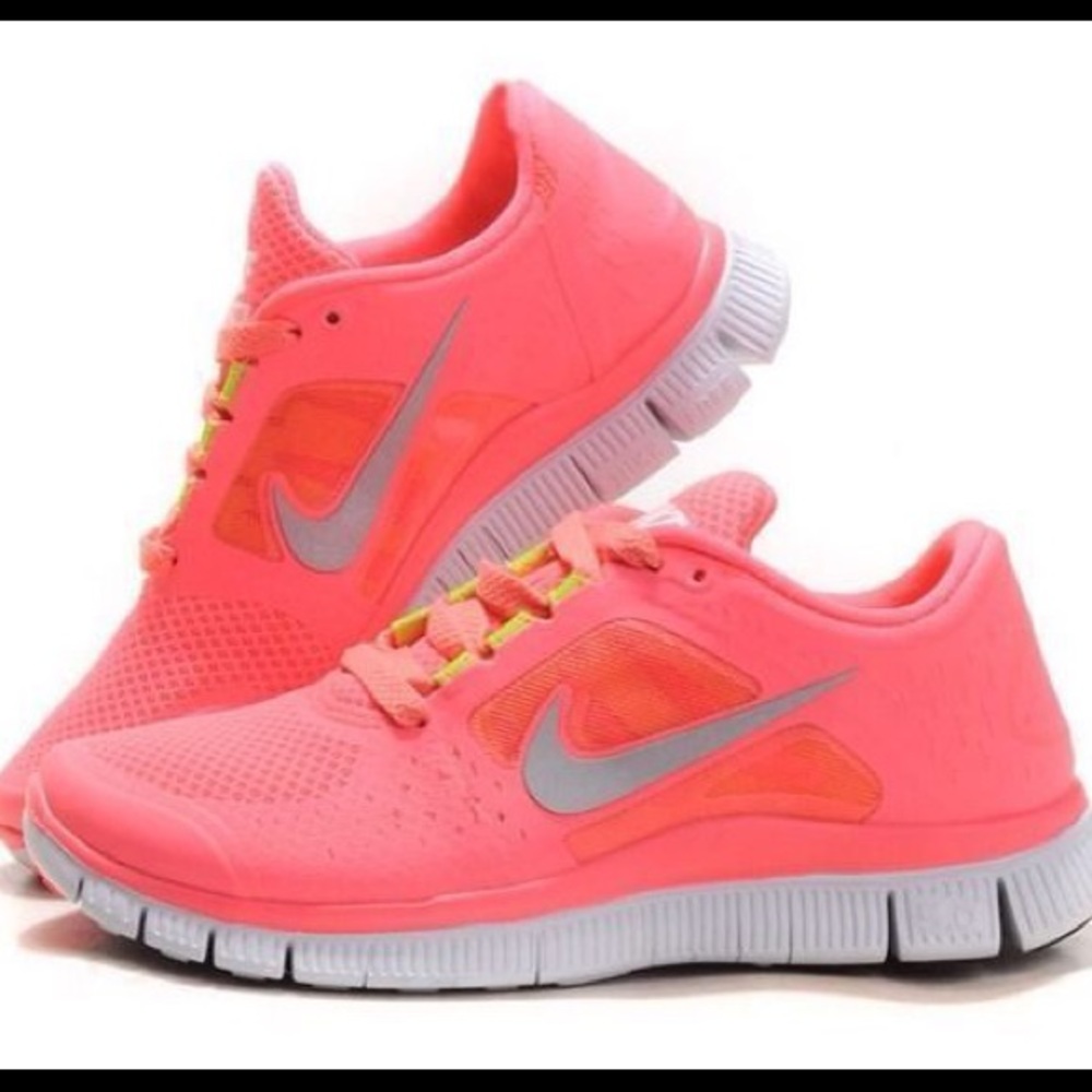 Neon pink nike frees
